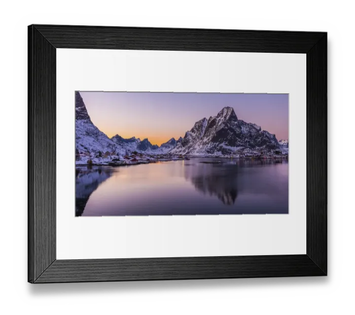 Framed Print : The small fishing village Reine on the Lofoten islands in Norway in winter with steep snowcapped mountains