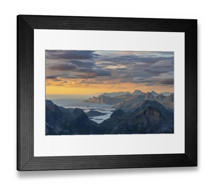 Framed Print : View over mountain tops and sea to Fredvang