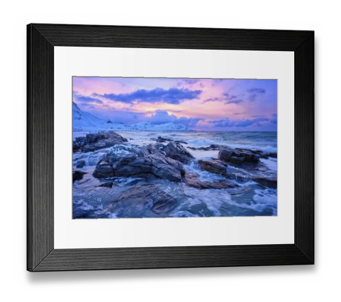 Framed Print : Waves of Norwegian sea on rocky coast in fjord on sunset with sun