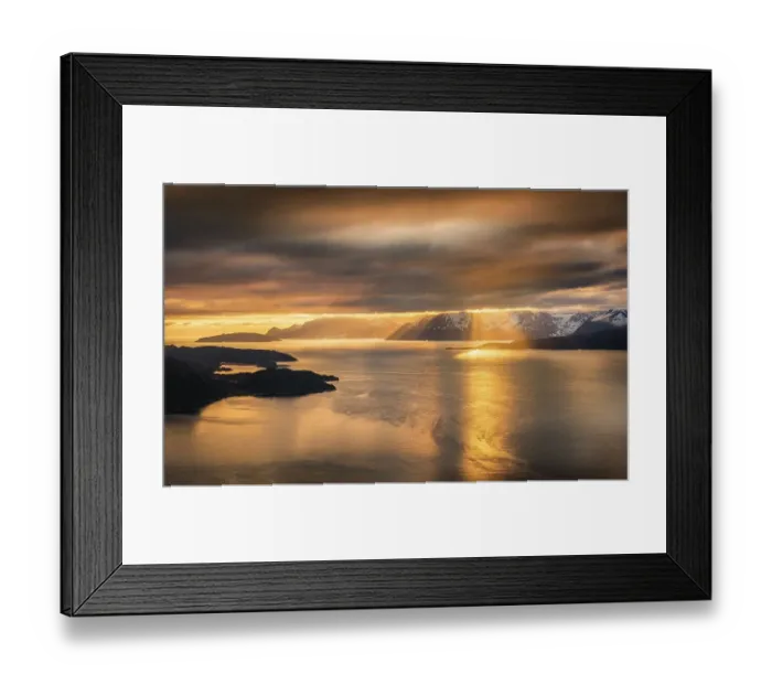 Framed Print : Dramatic cloud atmosphere with sunshine at the KvaenangenFjord