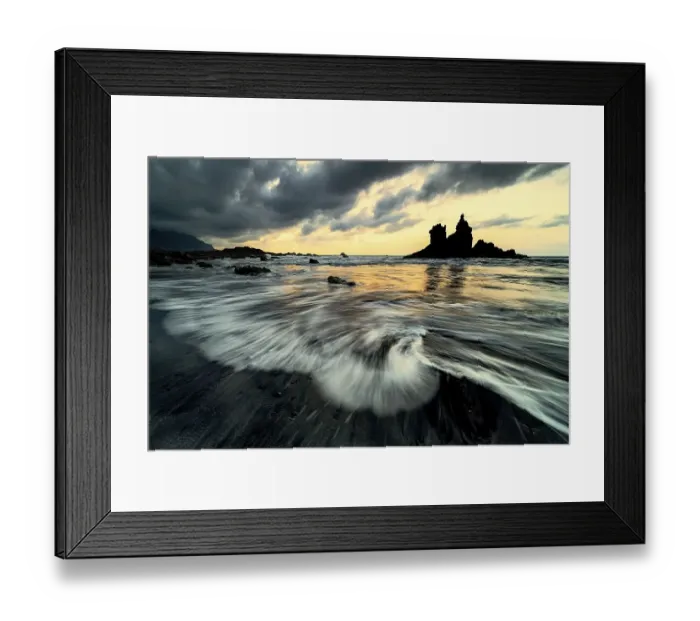 Framed Print : Dramatic cloud atmosphere with rock formation at sunset on the beach of Playa de Benijo