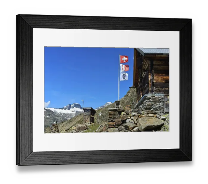 Framed Print : Flagpole with the flags of Switzerland