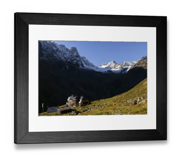 Framed Print : Westfalenhaus in front of on mountain meadow in front of snowy peaks of the Sellrain mountains