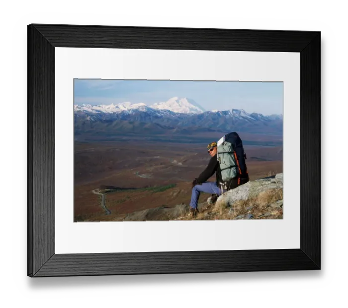 Framed Print : Hiker resting in the mountains