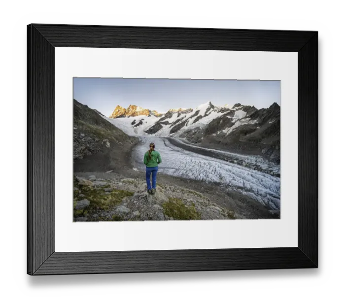 Framed Print : Mountaineer standing in front of glacier