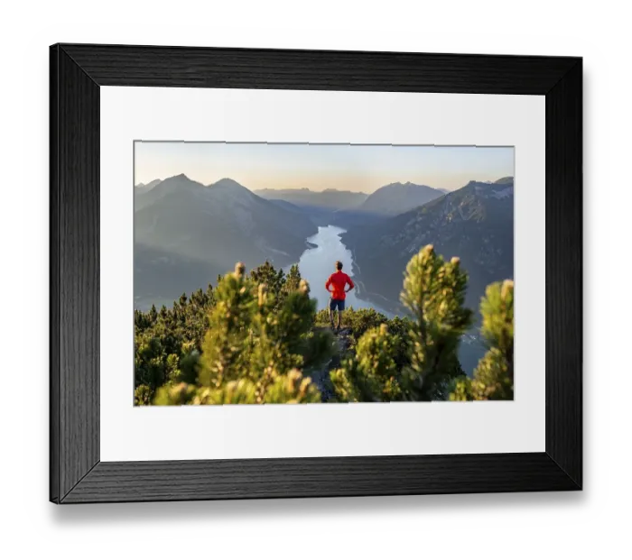 Framed Print : Mountaineer, young man looking over mountain landscape Framed Print : Mountaineer, young man looking over mountain landscape