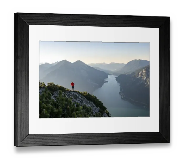 Framed Print : Young man looking over mountain landscape