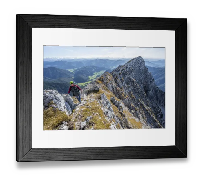Framed Print : Hiker with climbing helmet, on hiking trail at a ridge Framed Print : Hiker with climbing helmet, on hiking trail at a ridge