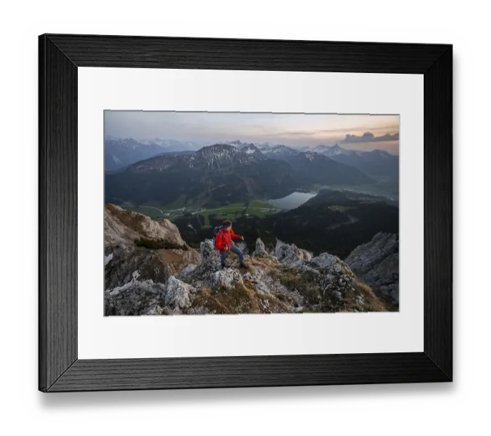 Framed Print : Hiker at the summit of Schartschrofen at sunset