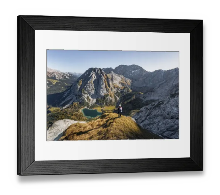 Framed Print : Young woman with climbing helmet looking at Seebensee from the Ehrwalder Sonnenspitze