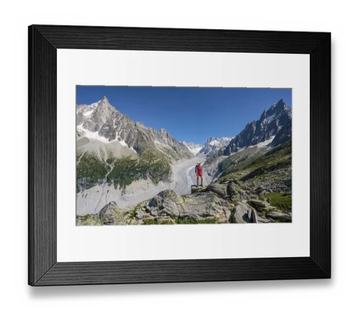 Framed Print : Climber standing on rocks, Grand Balcon Nord