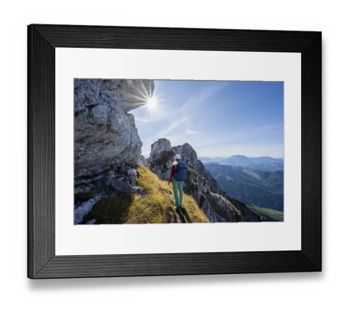 Framed Print : Sun shining on a hiking trail with hiker