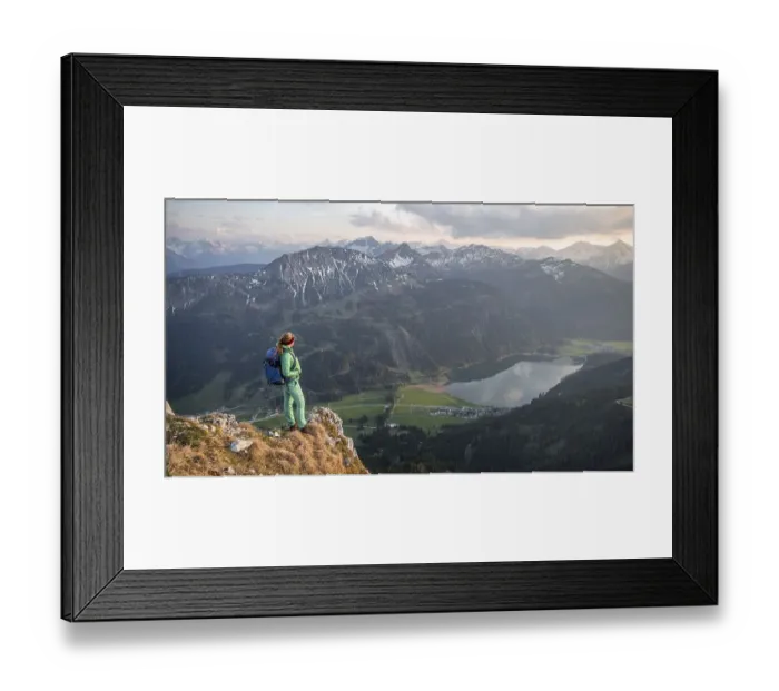 Framed Print : Evening atmosphere, mountaineer at the summit of Schartschrofen looking down on Haldensee