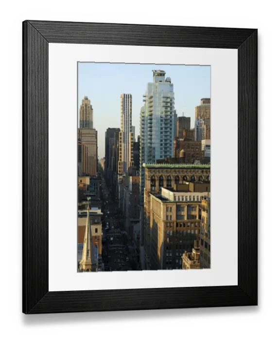 Framed Print : View from above onto the dark street canyon of Fifth Avenue with its skyscrapers Framed Print : View from above onto the dark street canyon of Fifth Avenue with its skyscrapers