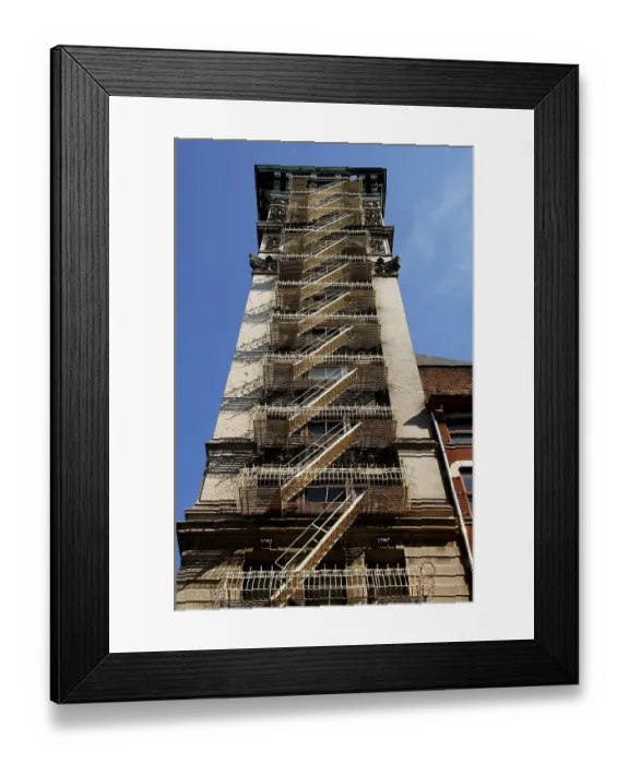 Framed Print : High rise with fire escape ladders