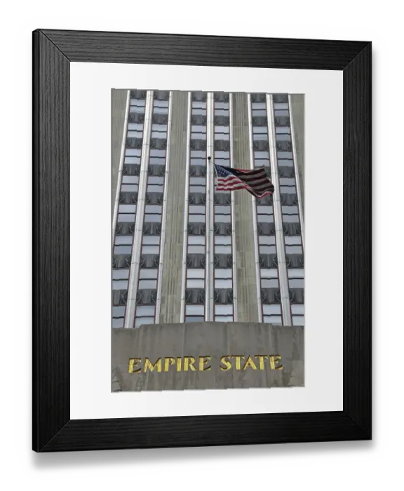 Framed Print : Empire State Building with an American flag