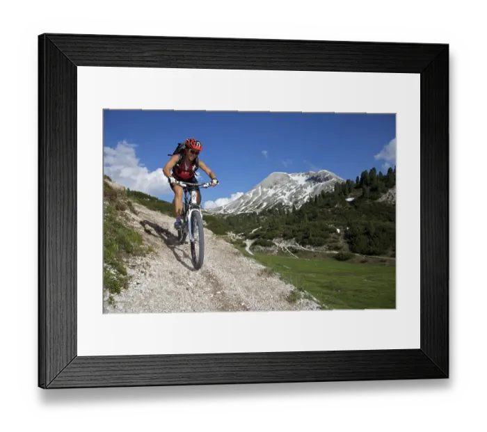 Framed Print : Mountain bike rider above the mountain village Fodara Vedla Framed Print : Mountain bike rider above the mountain village Fodara Vedla