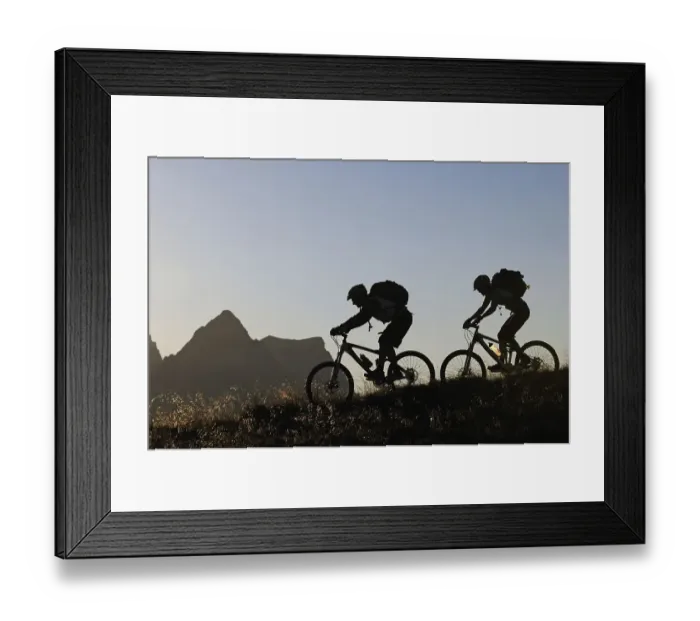 Framed Print : Mountain bikers on Mt Feuerpalven
