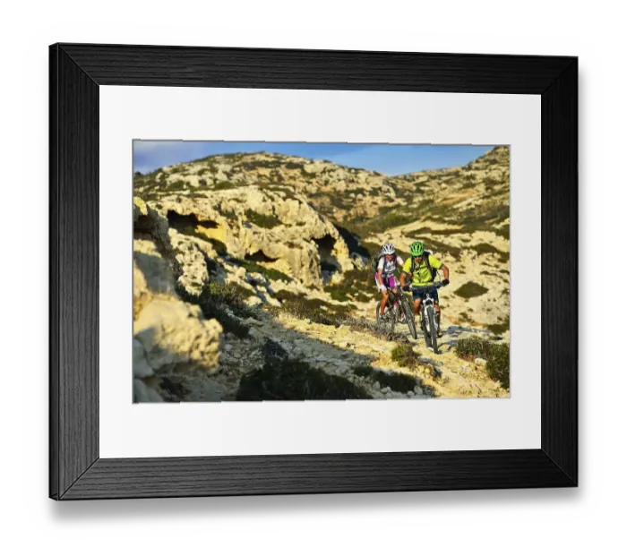 Framed Print : Two mountain bikers cycle in rocky terrain Framed Print : Two mountain bikers cycle in rocky terrain