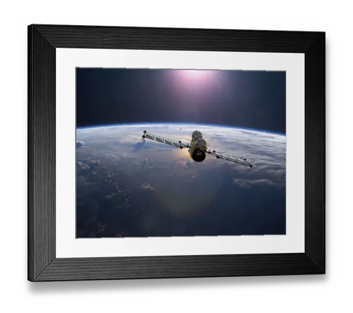 Framed Print : Geostationary orbit military satellite above the Earth pointed toward the rising sun