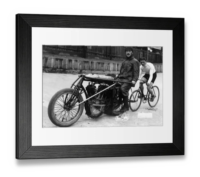 Framed Print : Bicycle rider in tow of a motorcyclist Framed Print : Bicycle rider in tow of a motorcyclist