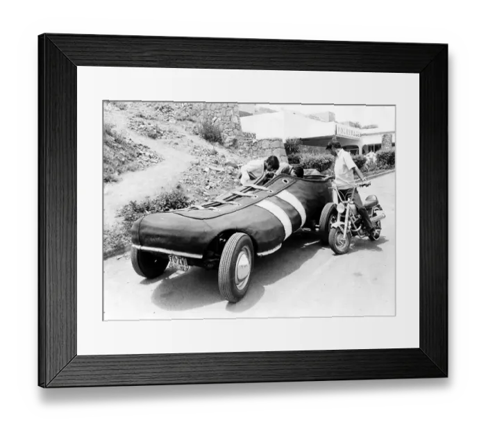 Framed Print : Teenagers look in car as a sneaker