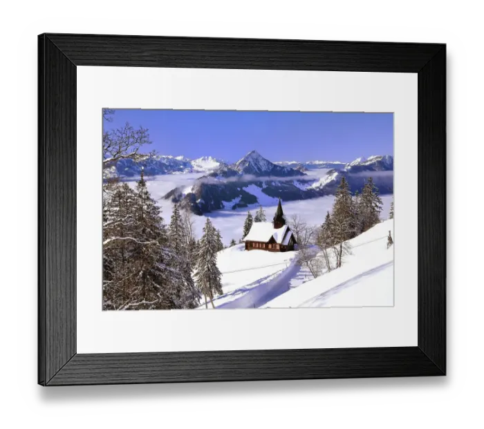 Framed Print : Chapel in winter with view on the Hochflue and the Central Swiss Alps Framed Print : Chapel in winter with view on the Hochflue and the Central Swiss Alps