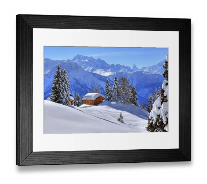 Framed Print : Winter landscape with deep snow-covered chalets