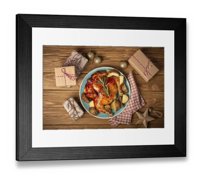 Framed Print : Festive Christmas dinner with roasted whole chicken top view on wooden rustic background with Xmas toys