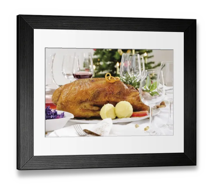 Framed Print : Roast goose, red cabbage, dumplings on a festively decorated table