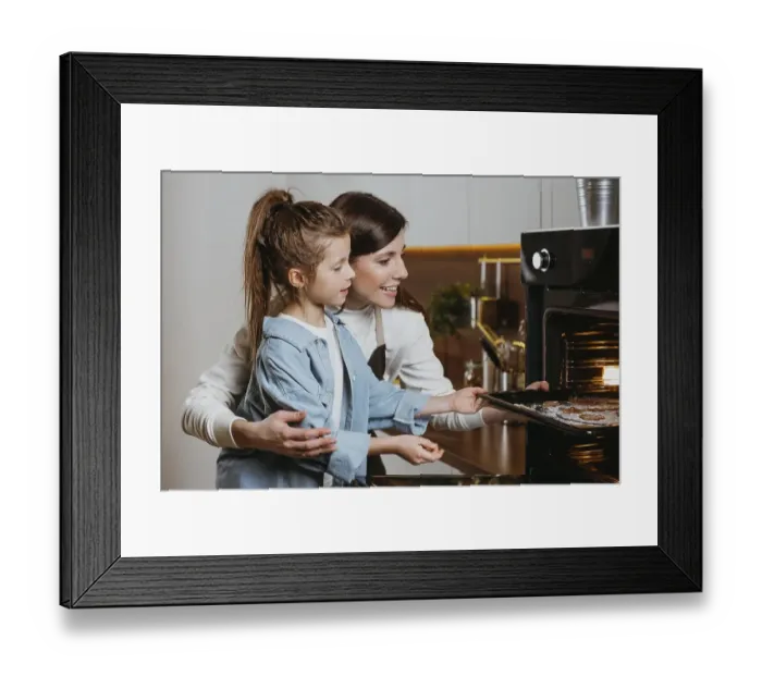 Framed Print : Mother daughter baking cookies home together Framed Print : Mother daughter baking cookies home together