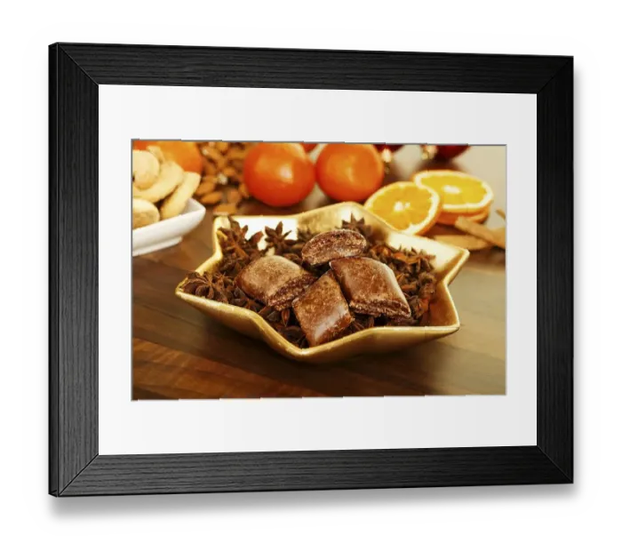 Framed Print : Magenbrot in a star shaped dish with Orange slices at back