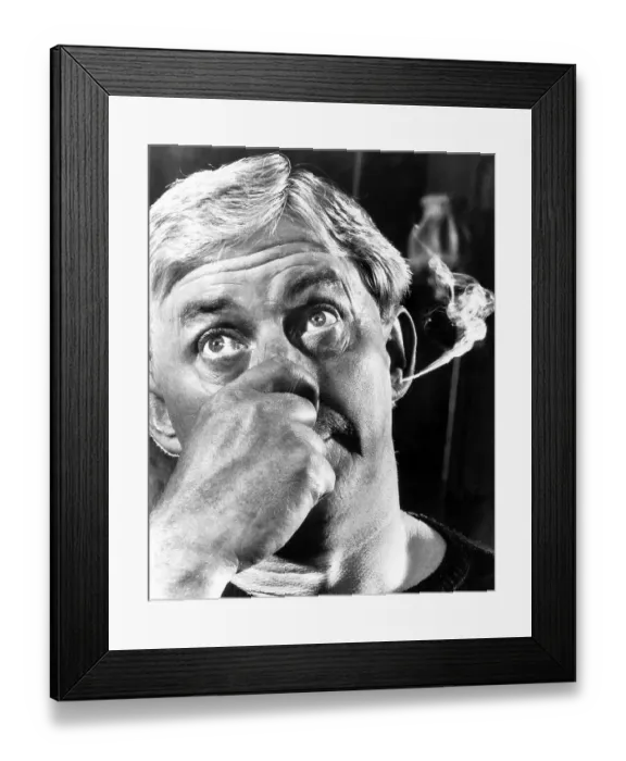 Framed Print : Man smokes through ear, England, Great Britain