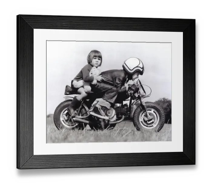 Framed Print : Boy and girl riding a motorcycle