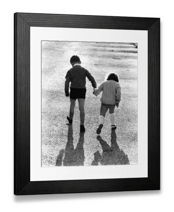 Framed Print : Children run hand in hand, England, Great Britain