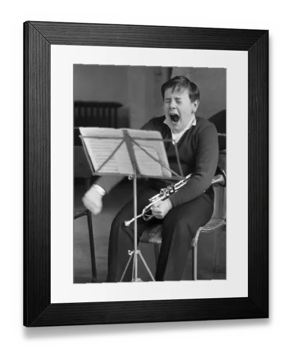 Framed Print : Boy yawns, trumpet, England, Great Britain