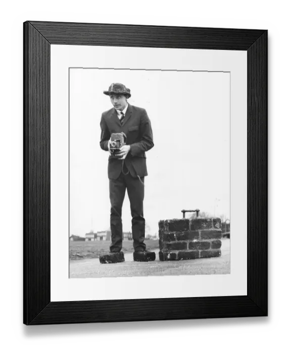 Framed Print : Photographer, man with suitcase