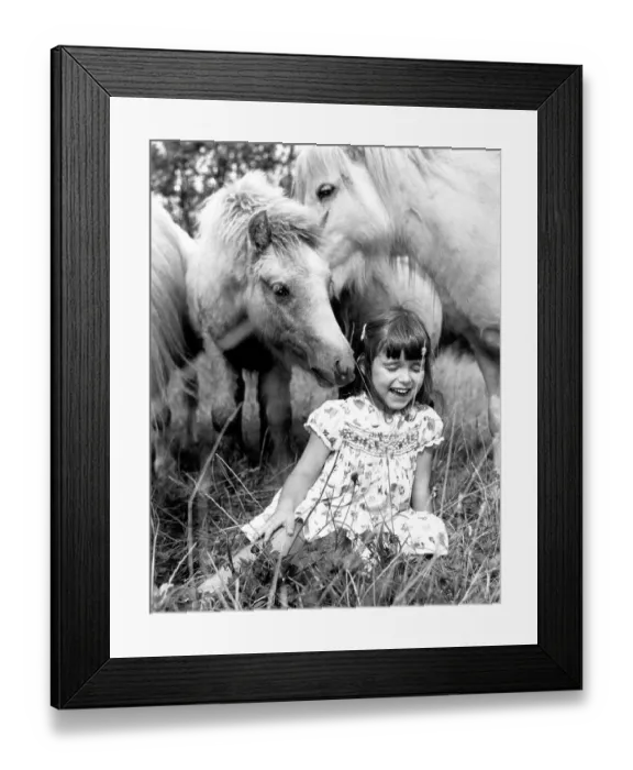 Framed Print : Horses sniff a girl, England, Great Britain