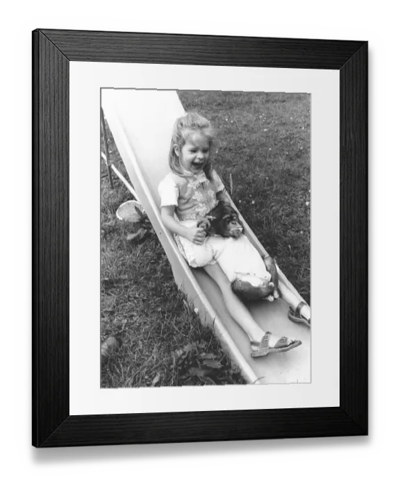 Framed Print : Girl and chimpanzee on the slide