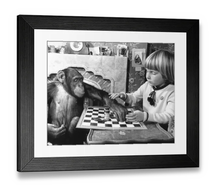 Framed Print : Girl and chimpanzee playing the mill game
