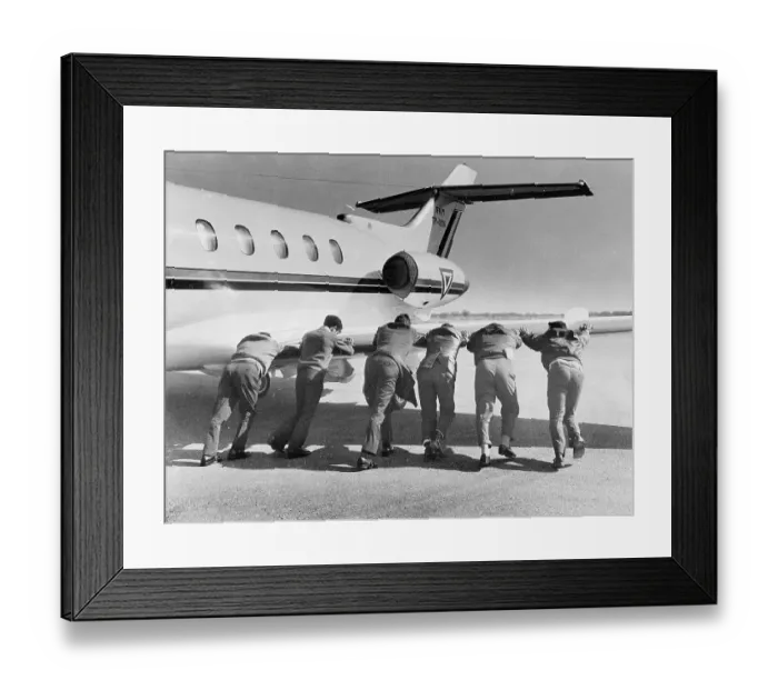 Framed Print : Men pushing an airplane, Mexico City