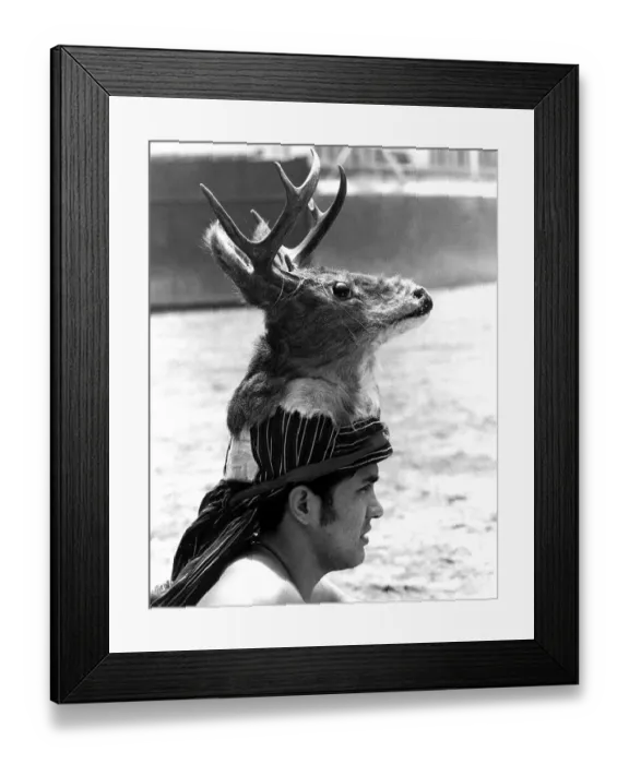 Framed Print : Man wearing deer head on his head Framed Print : Man wearing deer head on his head