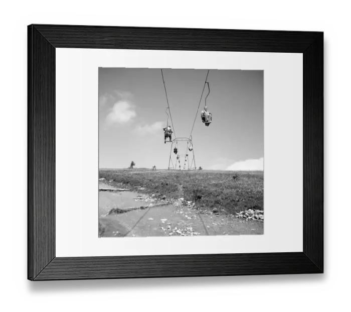 Framed Print : People travel with a chairlift