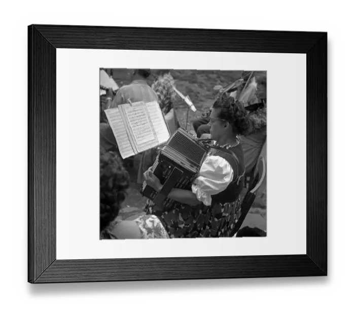 Framed Print : Woman plays accordion after notes Framed Print : Woman plays accordion after notes