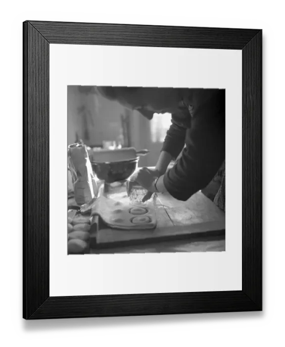 Framed Print : A baker uses a drinking glass as a baking tin