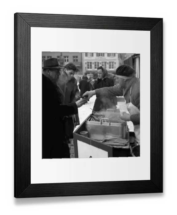 Framed Print : Bockwurst salesman in winter on a street in Freiburg