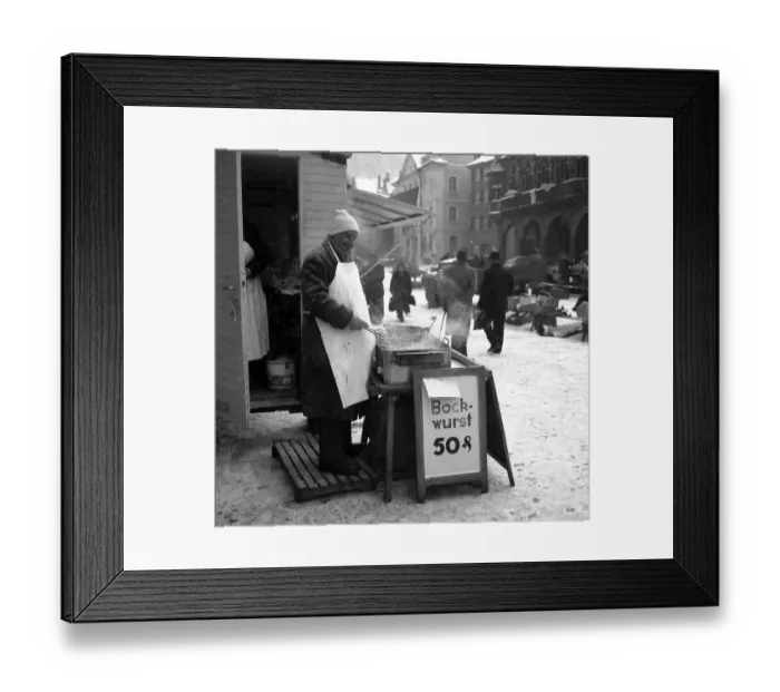 Framed Print : Bockwurst salesman in winter on a street in Freiburg