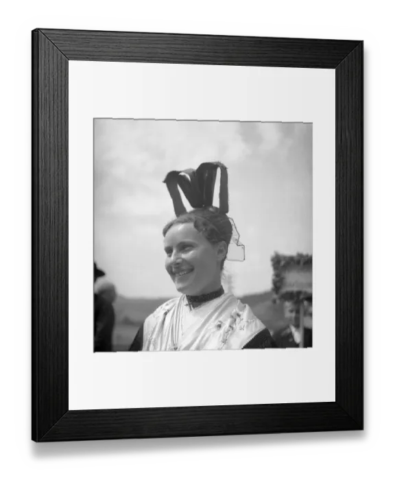 Framed Print : Woman in traditional traditional costume with hat