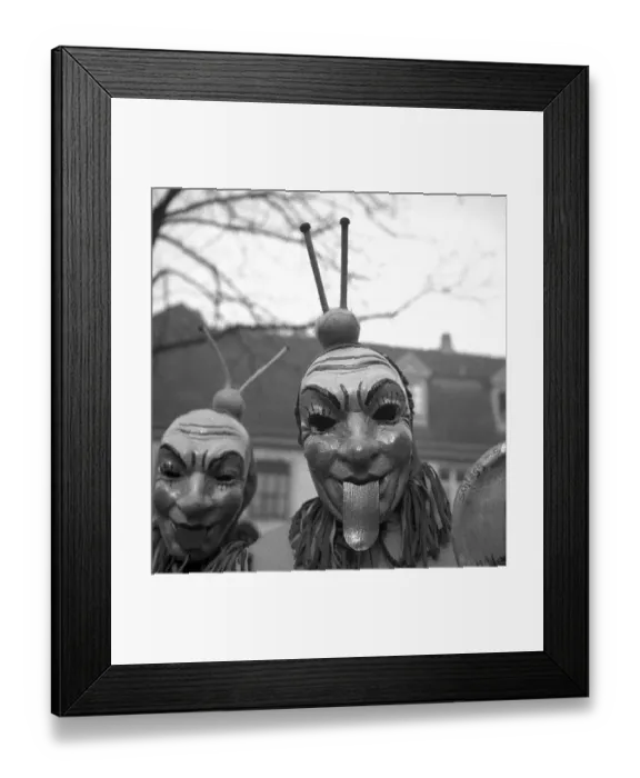 Framed Print : Men with mask stick their tongues out
