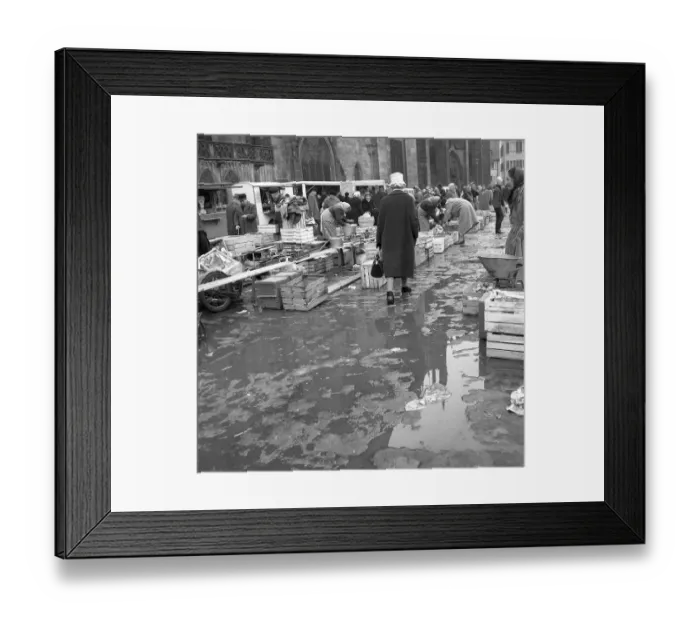 Framed Print : Rain puddles on the market place